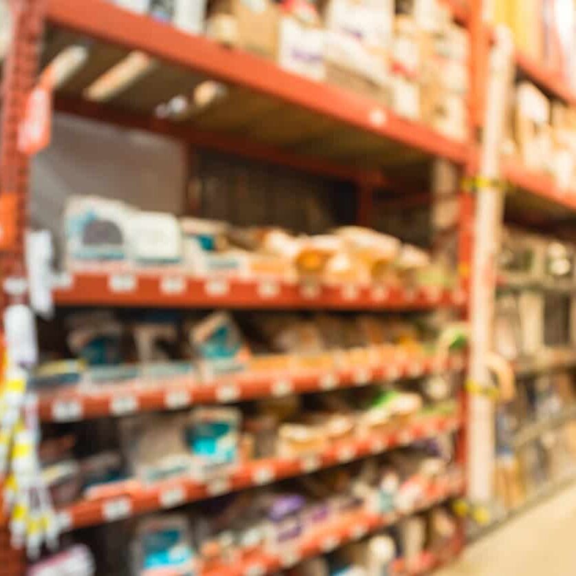 Industrial shelving units stocked with various hardware supplies at PICS | Inventory Specialists.